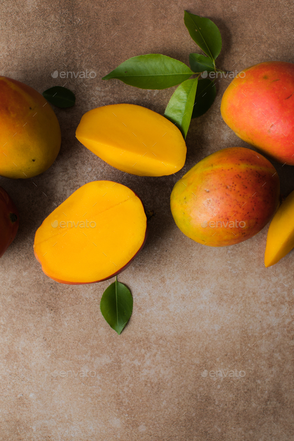 Mango background design concept. Top view of fresh mango fruit pattern