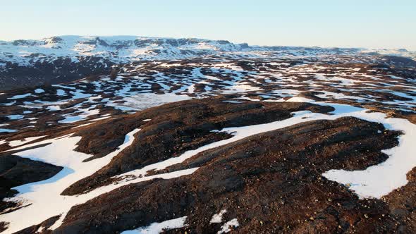 Aerial Flying Over Snow Covered Highland Landscape In Norway. Dolly Forward, Establishing Shot alt