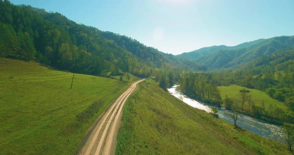 Low Altitude Flight Over Fresh Fast Mountain River with Rocks at Sunny Summer Morning alt