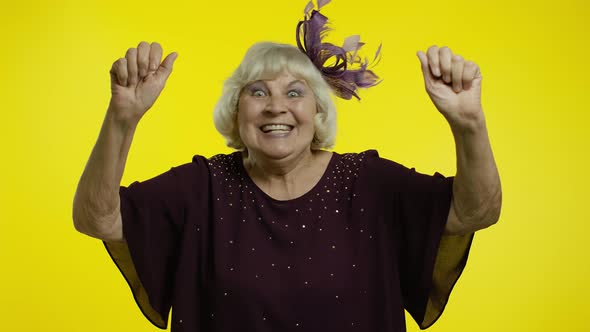 Extremely Happy Satisfied Senior Old Woman with Blond Hair Celebrating Victory with Smile, Success alt