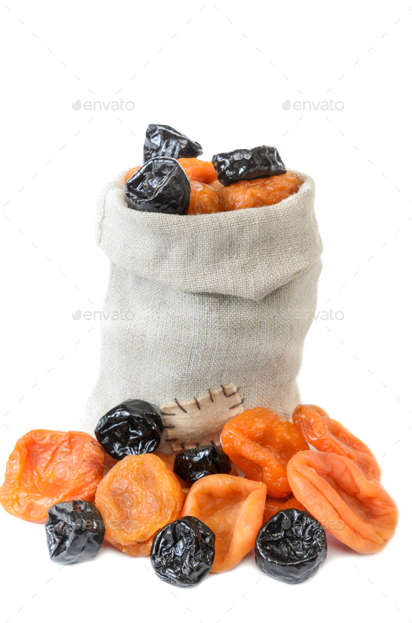 dried apricots and prunes in a woven bag Stock Photo by begemot_dn