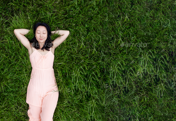 Beautiful Young Asian Woman Lies On The Grass Fresh Natural Summer