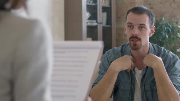 Frustrated Man Talking to Therapist alt