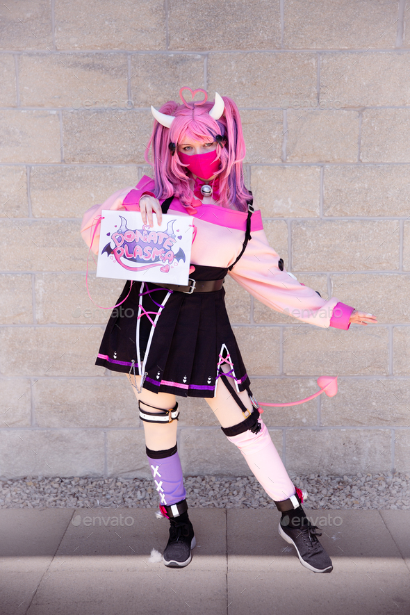 Pretty girl Anime character in pink cosplay costume