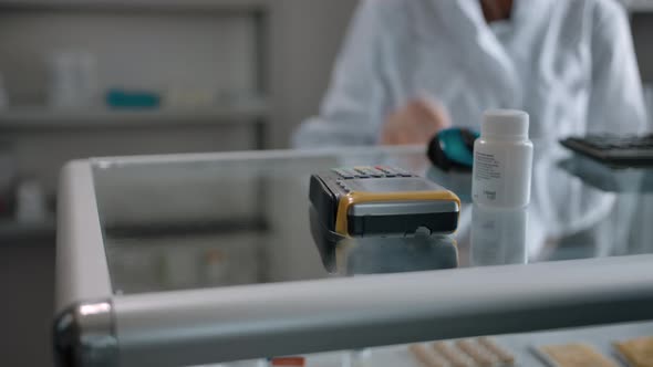 Unrecognizable Person Enters the Amount to Pay By Credit Card at the Pharmacy alt