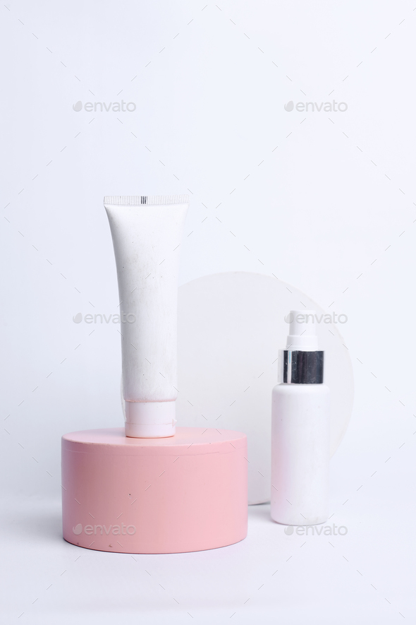 Place it - White blank plastic packaging cosmetic stand on pink podium