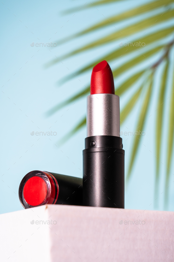 Lipstick on podium at blue background. Stock Photo by Nadianb | PhotoDune