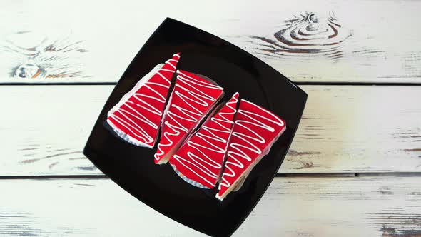 Slices of Red Cakes on Black Plate alt