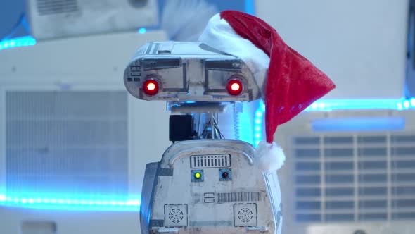 Robot Speaking With A Santa Claus Hat