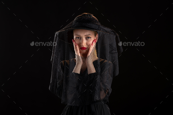 mourning woman dressed in black for funeral on black isolated background grim reaper death