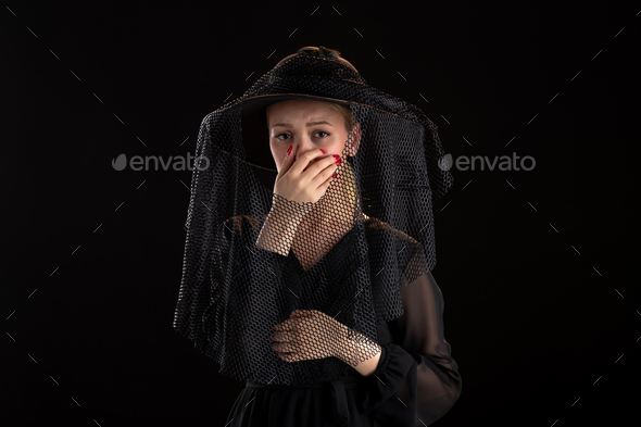 mourning woman dressed in black for funeral on the black isolated background grim reaper death