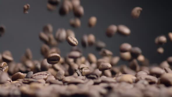 Closeup Coffee Beans Fall on Heap alt
