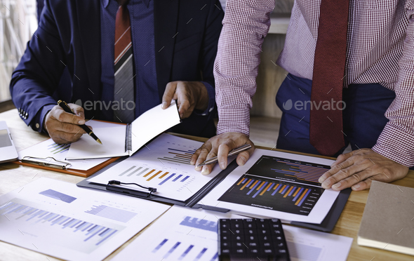 Business people analyze data for market planning, financial charts to analyze profits, investment re