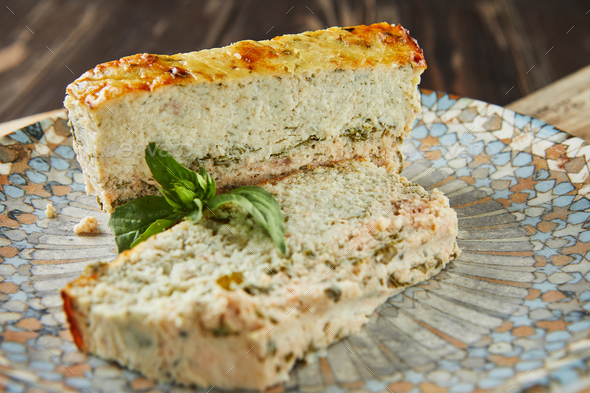 Salmon and dennis pate sliced slices on plate of basil. French