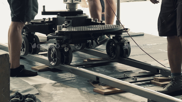 Setting dolly track for video shooting production