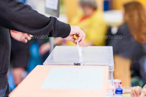 voting candidate campaign in democracy ballot box. Latin mid hand unrecognizable man