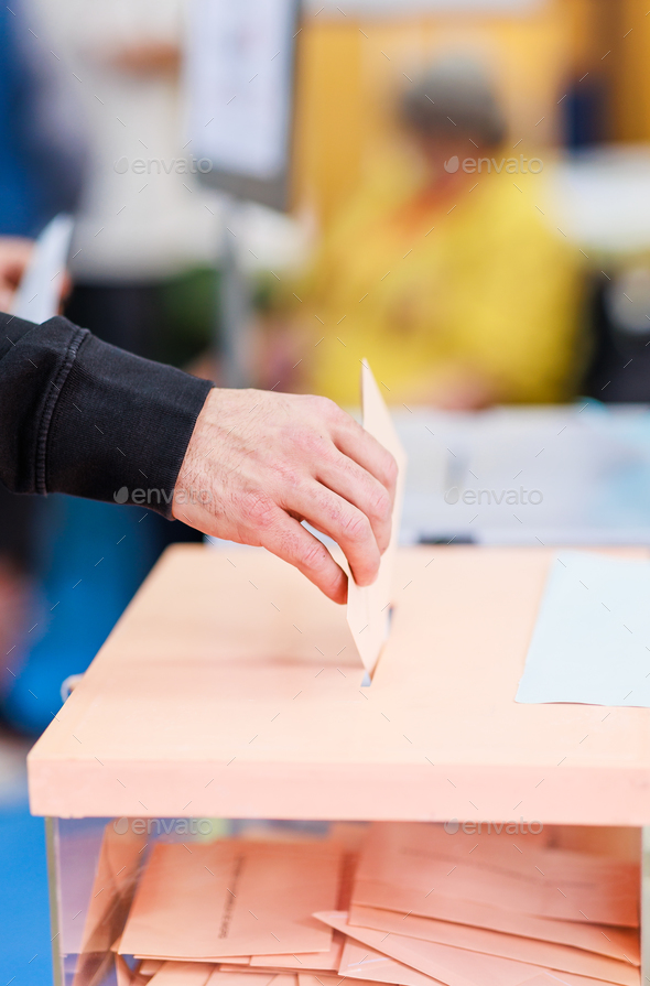 voting candidate campaign in democracy ballot box. Latin mid hand unrecognizable man