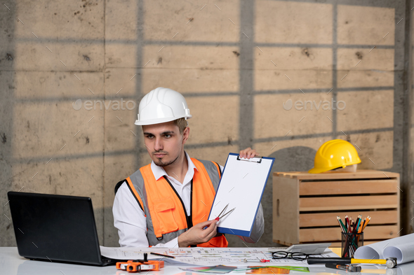 engineer smart young handsome cute guy civil worker in helmet and vest on zoom call