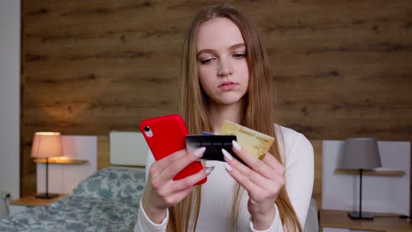 Woman Hold in Hands Credit Bank Card Using Mobile Cell Phone Order Delivery Online Shopping Payment alt