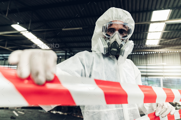 Scientist wear Chemical protection suit check danger chemical, working at dangerous zone
