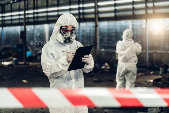 Scientist wear Chemical protection suit check danger chemical, working at dangerous zone