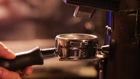 Barista hand prepares coffee powder for tamping fresh ground coffee. Coffee Grounds Espresso