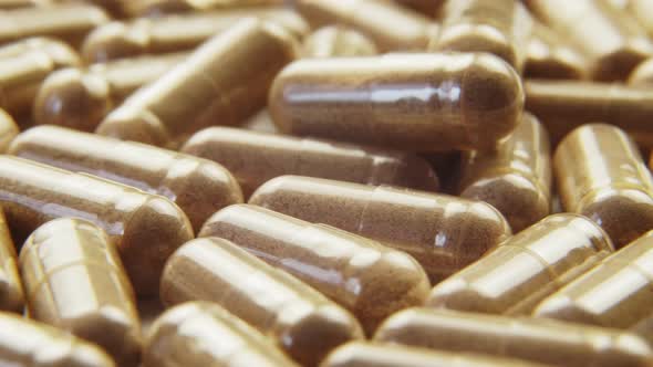 Pills Capsules with Biologically Active Additives Rotation Macro Shot