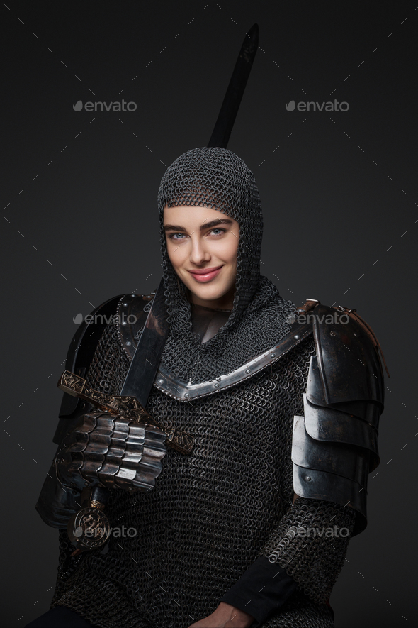 Stunning portrait of a female knight in medieval armor Stock Photo by
