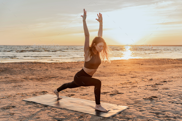 Balance and meditation woman training yoga asana outdoors near the lake. Peace and harmony