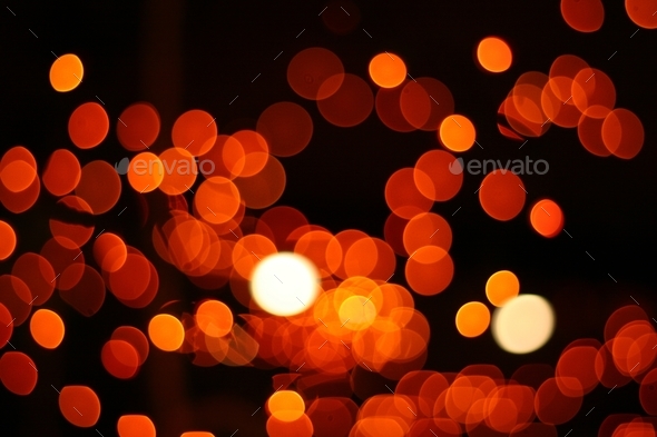 Orange bokeh lights on a black background- a cool wallpaper