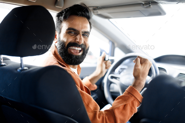Emotional Indian Driver Man Driving Car Shaking Fists In Auto
