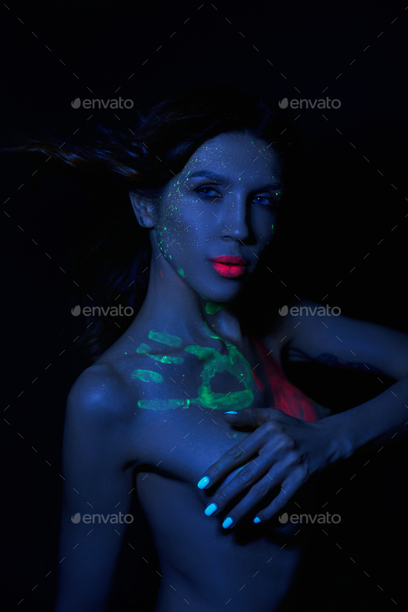 Sexy Nude Woman In Neon Light Uv Paint On The Woman Face And Body