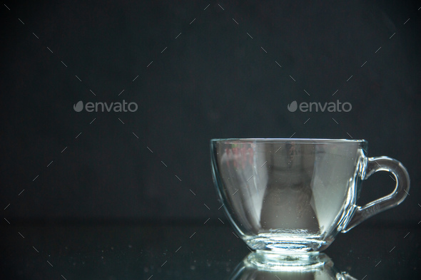 Free Photo  Close up view of empty glass cup on the right side on dark  background with free space