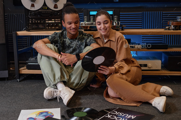 Smiling young couple choosing vinyl records