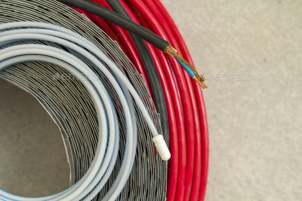 Heating floor system wires and cables. Renovation and construction concept. Comfort house.