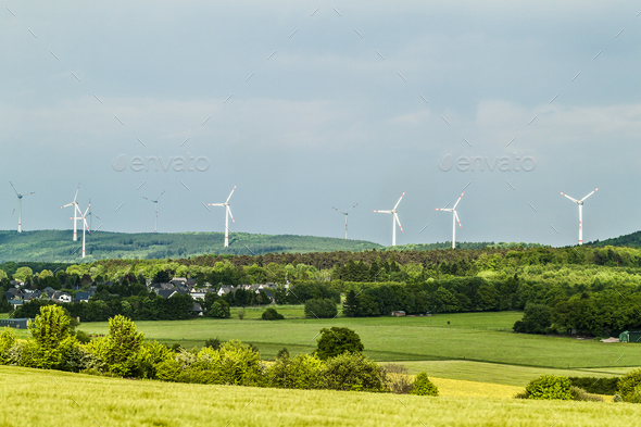Wind turbine renewable energy source summer landscape with clear blue sky