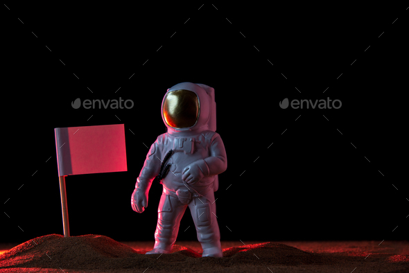 front view of white astronaut with white flag on dark floor discovery moon cosmic