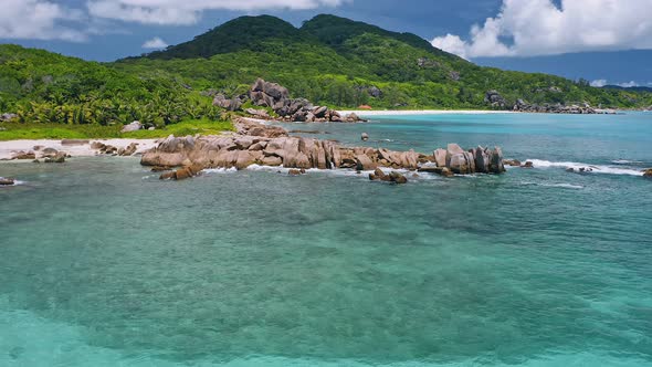 Aerial Drone Footage of Exotic Tropical Coastline at La Digue Island Seychelles alt