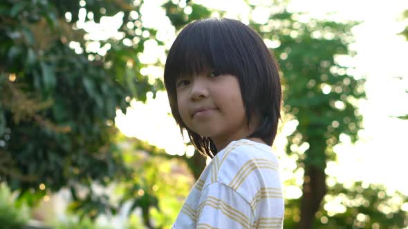 Close Up Of Happy Asian Child Outdoor alt