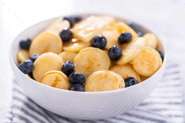 Mini pancake cereal Stock Photo by arina-habich