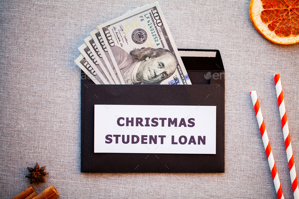 Student loan in a black envelope on a Christmas background