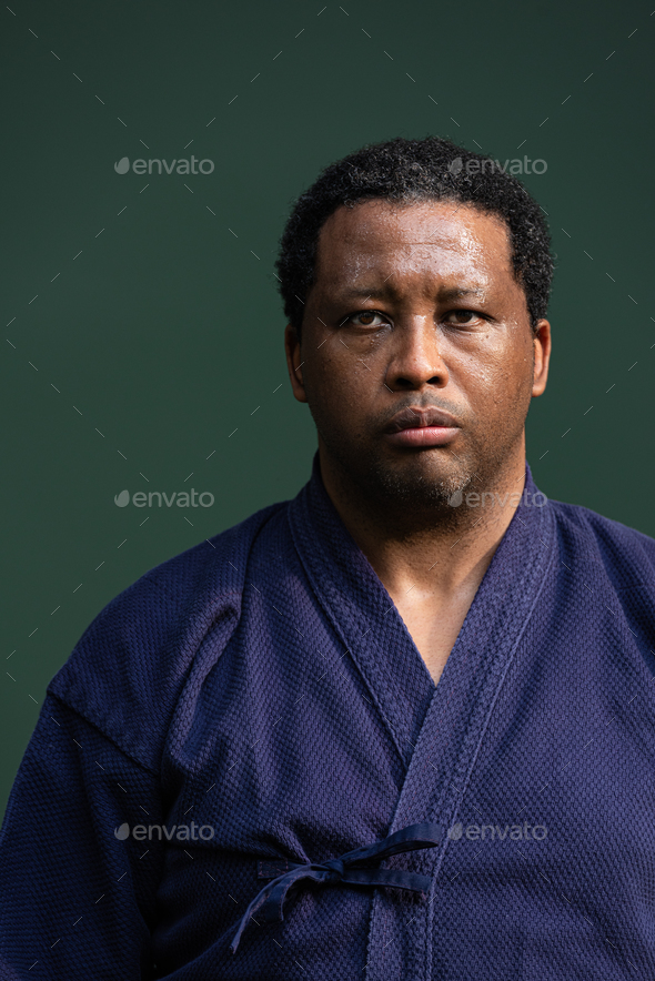 Handsome black martial artist man with martial arts costume of kendo