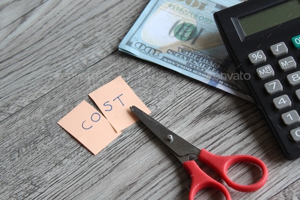 Scissor, calculator, money and note with text COST