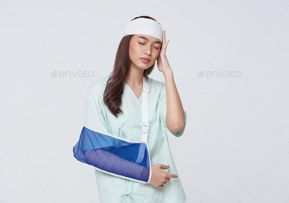 asian woman patient wearing soft splint due to sore arm and broken head