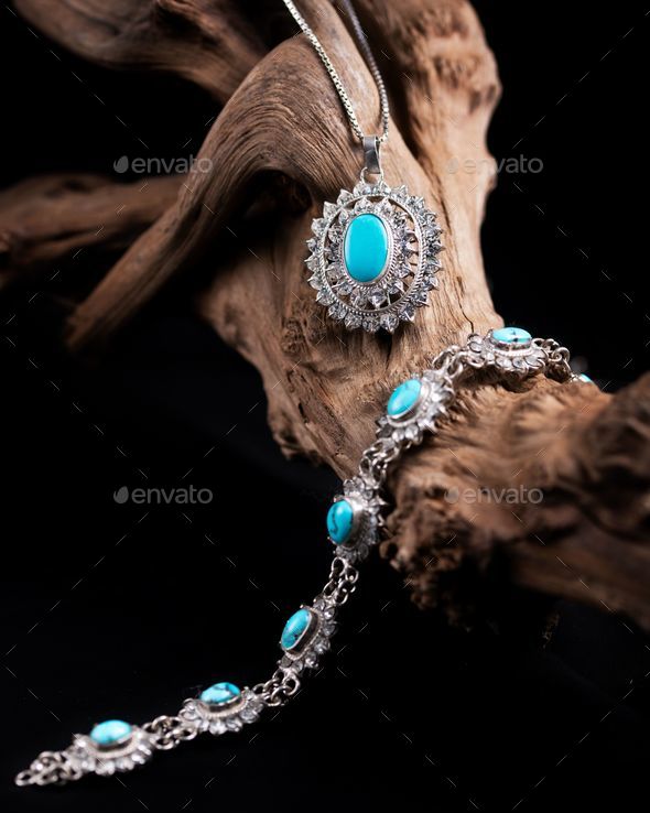 Close-up shot of a precious bracelet and necklace with turquoise gem