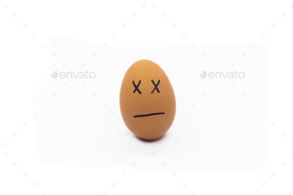 an egg with drawn faces, a sad expression isolated on white
