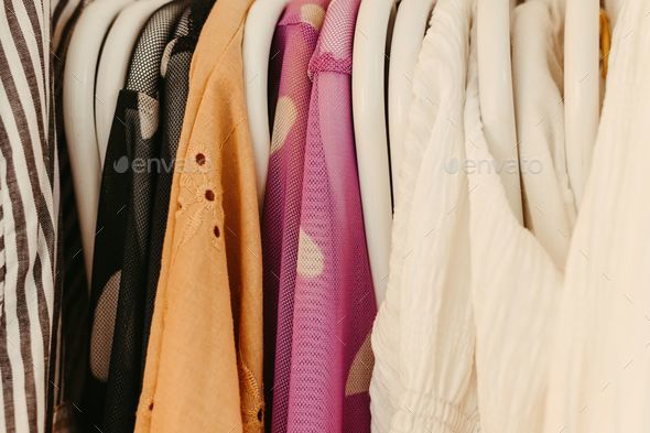 Array of vibrant shirts displayed in a neat and organized fashion on a clothing rack