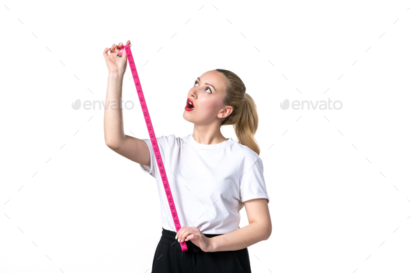 Women's waist with a measuring tape on white background, Stock image