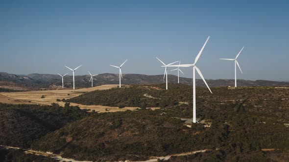 Wind Farm Field Generate Green Alternative Energy in Desert Wild Nature Landscape