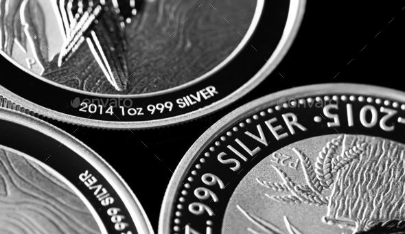 Grayscale closeup of silver coins Stock Photo by wirestock PhotoDune